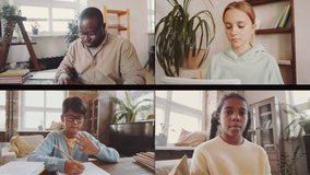 Group video call interface of Afro-American male teacher giving online lesson to little multiethnic children while working remotely with elementary school students during covid-19 lockdown