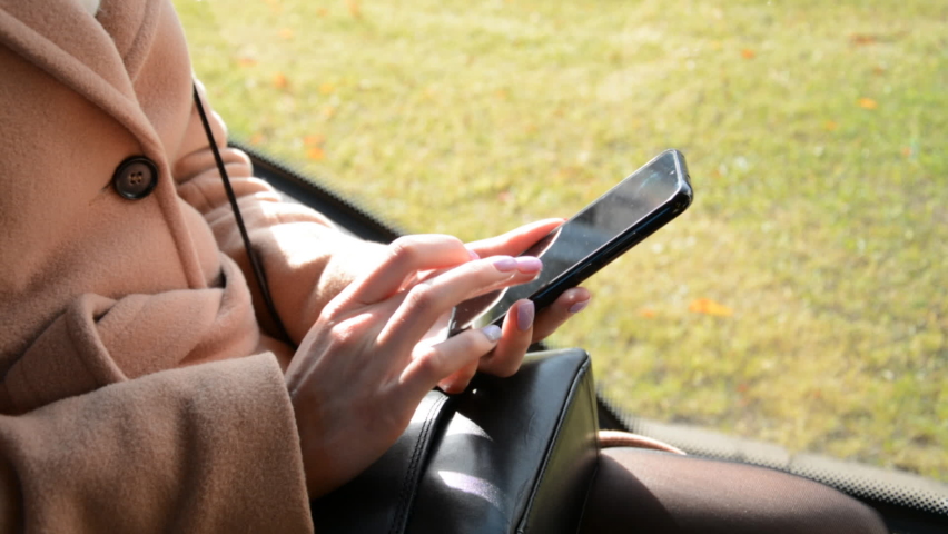 girls hands write a message in a city bus close up