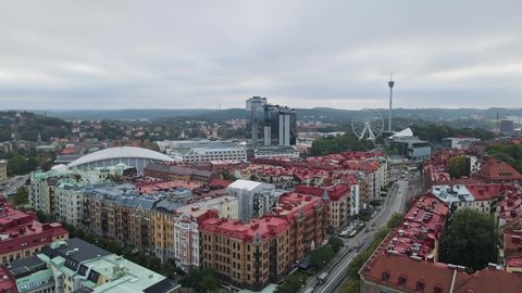 Flying Over The Beautiful District Of Lorensberg Overlooking The Scandinavium, Ferris Wheel, And AtmosFear At Liseberg Amusement Park In Gothenburg, Sweden. - aerial drone shot