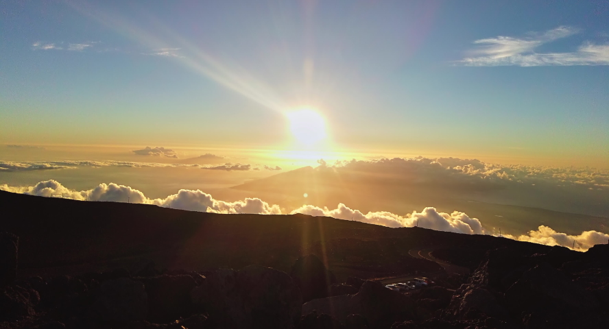 Time Elapse of Clouds Floating In Valley with the setting sun,Haleakala National Park, Maui, Hawaii,USA