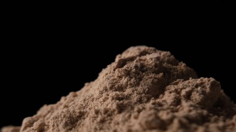 Protein powder in scoop, close up