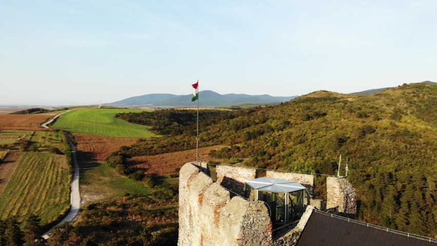 Aerial View of Hungarian National Flag Waving on Top of Ancient Boldogko Castle