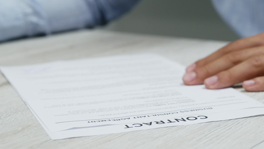Close-up of businessman hands putting signature on paper. Signs a contract in slow motion. Successful deal, negotiations Royalty-Free Stock Footage #1061102215