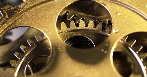 Close Up Old Golden Gears Turning in Working Mechanism 