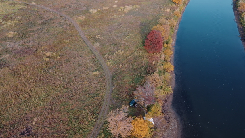 The river is divided into several channels. Autumn landscape. Shooting from a copter