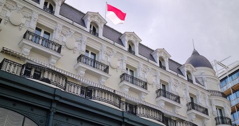 Typical Building Facade In Monte-Carlo Monaco, Belle Epoque Architecture With Monaco Flag Waving In The Wind - DCi 4K Video