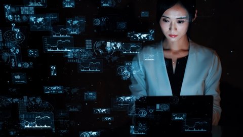 Young asian woman watching hologram screens. Digital transforamtion. GUI (Graphical User Interface).