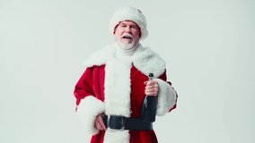 cheerful santa claus showing champagne bottle at camera isolated on white