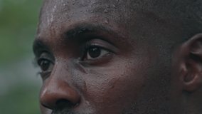 Portrait of athletic perspiring guy resting after powerful workout training, African American bodybuilder man looking to camera - Powered by Shutterstock - Get 15% off with code: PIKWIZARD15