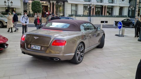 Monte-Carlo, Monaco - October 21, 2020: 8K Rich Old Man Driving A Luxury Bentley Continental GTC British Sports Car On Casino Square In Monte-Carlo, Monaco On The French Riviera, Europe - 8K UHD