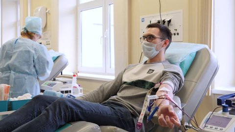 KAZAN, RUSSIA - OCTOBER 20, 2019: A person donates blood at a blood reception center.