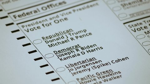Voting for Joe Biden and Kamala Harris on the official 2020 elections ballot. Portland, Oregon / USA - October 2020.