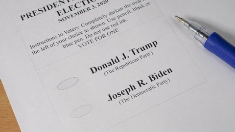 KYIV,UKRAINE-SEPTEMBER 10,2020: Pen, paper ballot on 2020 US presidential Elections. Candidate from Republican Party Donald Trump and from Democratic Party Joe Biden. The November 3, polling station