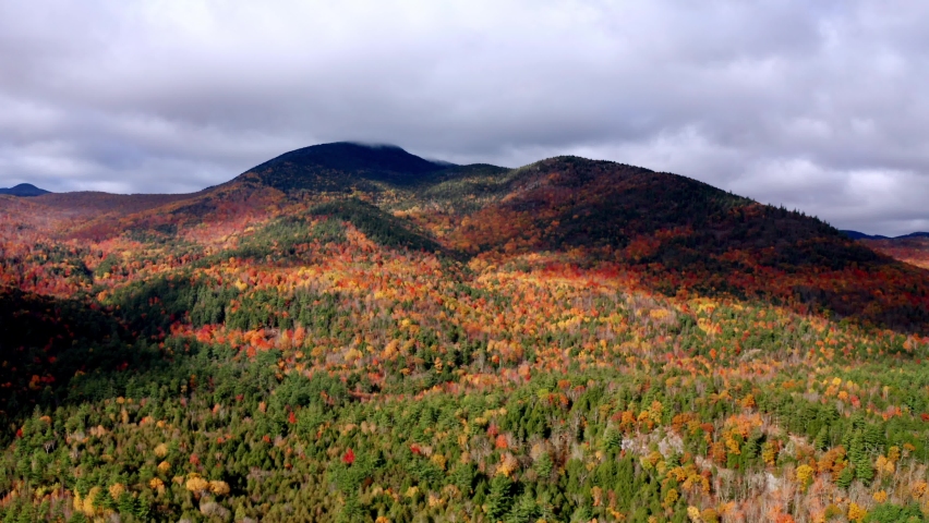 Aerial flythrough of Mountain Forests in Autumn with Fall Colors in Adirondacks, New York, New England