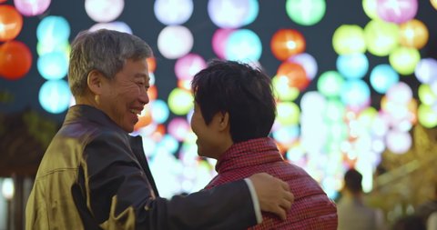 Asian elder couple visit lantern fesitival and see the night view during chinese new year 스톡 비디오