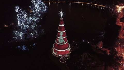 2021 aerial view of Christmas tree at city life scene at night. Urban district. Festive landscape. 2021 Christimas Tree. Christmas Time. Decoration for Holidays. Christmas Time. Christmas Santa Claus.