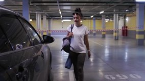 Teenager sport girl walking inside parking garage. Woman holding backpack and yoga mat. She goes to the car in the parking lot. Urban city lifestyle outdoors concept - Powered by Shutterstock - Get 15% off with code: PIKWIZARD15