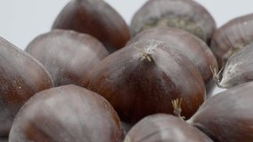Extreme close up chestnuts rotating on the turntable. Macro. Real time 4K