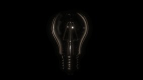 Switching on, turning off light bulb animation. Warm yellow light over dark black background. Bright glowing and flickering Edison Tungsten lamp. Retro vintage form. Creative idea concept. 3D 4K clip 