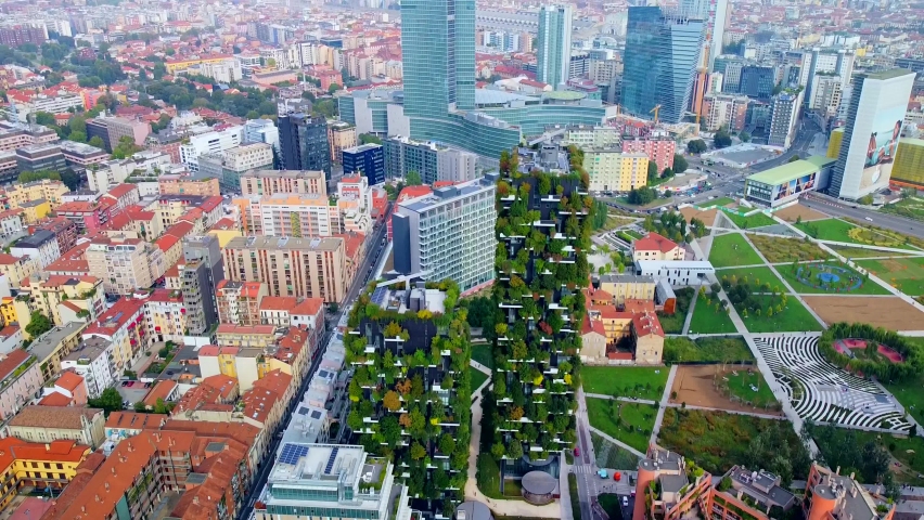 Aerial view of ecological skyscrapers with many trees on each balcony. Bosco Verticale. Modern architecture, vertical gardens, terraces with plants. Ecology. Green Planet. Milan. Italy, 01/10/2020: | Shutterstock HD Video #1061184196