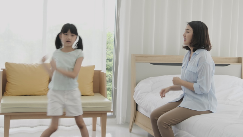 Happy family, Mother and daughter dancing merrily in the bedroom. Mother and child dance. Happy Family Concept. Royalty-Free Stock Footage #1061188168