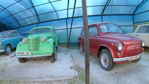 Istra, Moscow region, Russia - June 16, 2020: Old Russian cars, industry of the USSR. Car brands are written in Cyrillic on license plates. Pobeda, GAZ, Moskvich 407, Moskvich 401, ZAZ 965 A, VAZ 2101