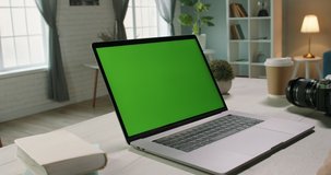 Close up shot of hands of remote worker gesturing near green screen laptop during video chat with employees or conference with customers - communnications concept 4k video template