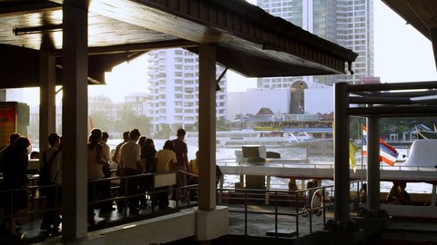 Passengers Boarding the Chao Pharaya Express Boat at Taksin Bridge Station
