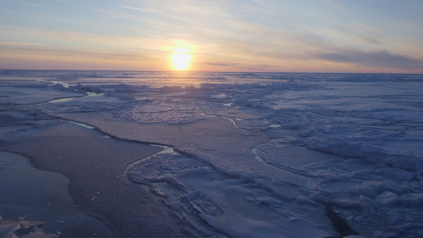 Arctic sunset over sheets of new sea ice at 87° North