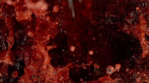 Super slow motion of pouring red wine. Filmed on high speed cinema camera, 1000 fps.
