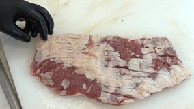 Cutting of sheep meat. Butcher chopping or cutting fresh lamb meat.Preparation of lamb ribs. Video