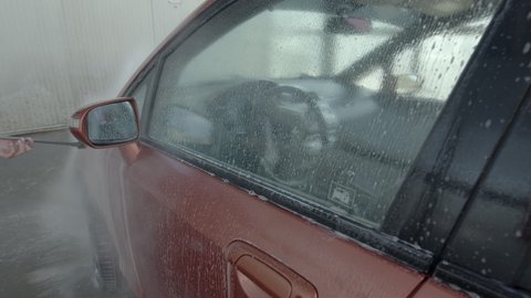Eashing dirty car closeup footage