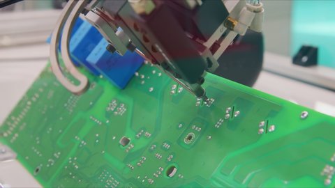 Automated robotic equipment repairing motherboard