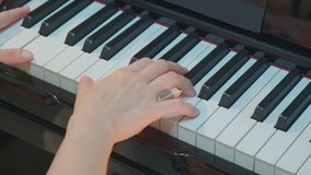 Pianist hands practicing piano. Musician artist play instrument, Concept Music education and performance. Music player playing  piano in slow motion 4K video handheld mood..