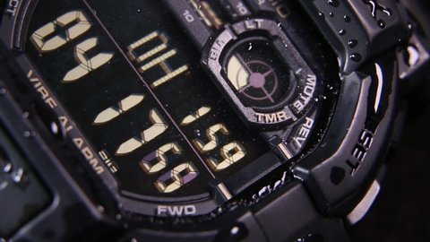 Macro close up of a tactical digital watch face functioning
