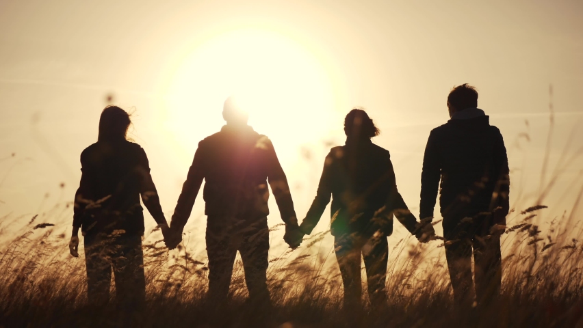 teamwork. team community hold hands together silhouette at sunset unity. group of people hands. teamwork a workers carry out put your hands up business. team in the company working partnership Royalty-Free Stock Footage #1061245912