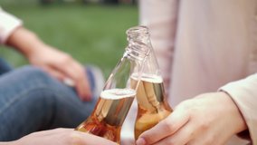 Close up of hands toasting with bottles of beer cheers. Celebration beer cheers. - Powered by Shutterstock - Get 15% off with code: PIKWIZARD15