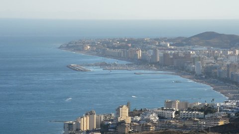 Overview of Málaga town of Fuengirola with the sea at sunset