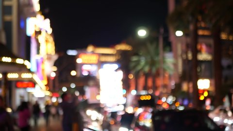 Defocused fabulous Las Vegas Strip boulevard, luxury casino and hotel, gambling area in Nevada, USA. Nightlife and traffic near Fremont street in tourist money playing resort. Neon lights of sin city.