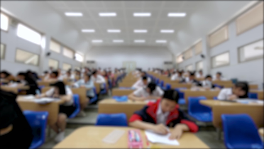 Blurred Time Lapse of Asian students taking an exam in class room Royalty-Free Stock Footage #1061261170