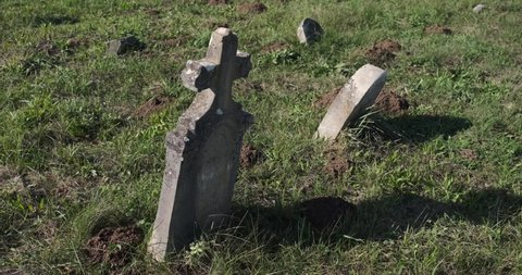 An old tombstone in an abandoned cemetery