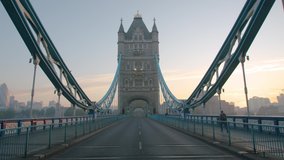 Lockdown in London, slow motion gimbal walk down Tower Bridge road during the COVID-19 pandemic 2020, with lone walker and cyclist. - Powered by Shutterstock - Get 15% off with code: PIKWIZARD15