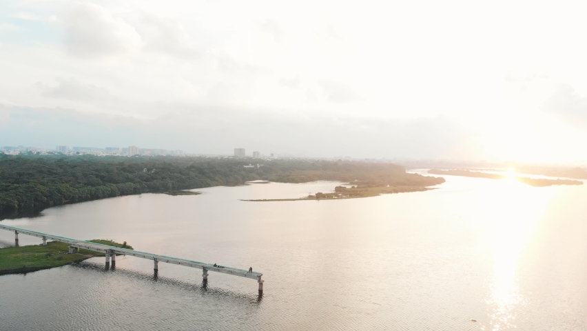 Aerial Over Broken Bridge in Adyar During Golden Yellow Sunset. Follow Shot