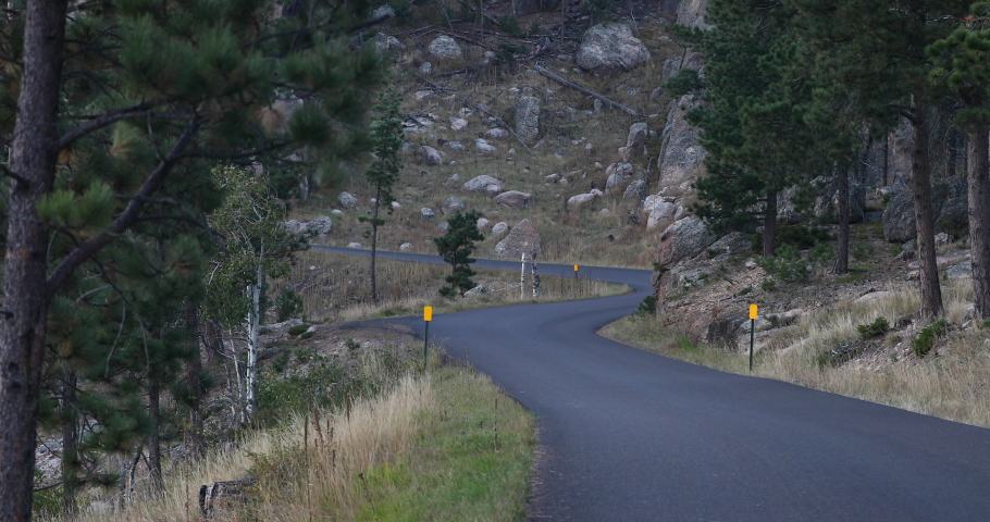 Custer South Dakota Black Hills windy road corners evening 4K. Black Hills of South Dakota. Mountain, valley, landscape scenic discovery. State Park with wildlife, lakes, campgrounds and picnic areas.