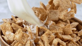 Super slow motion of falling chocolate cereals pieces with milk, camera motion. Filmed on high speed cinema camera at 1000fps. - Powered by Shutterstock - Get 15% off with code: PIKWIZARD15