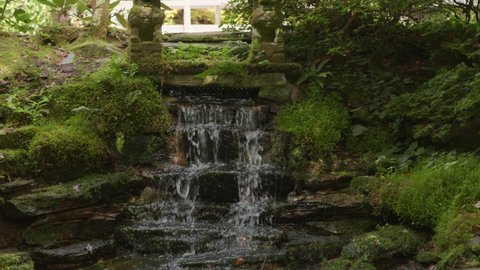 Small waterfall in beautiful Japanese garden