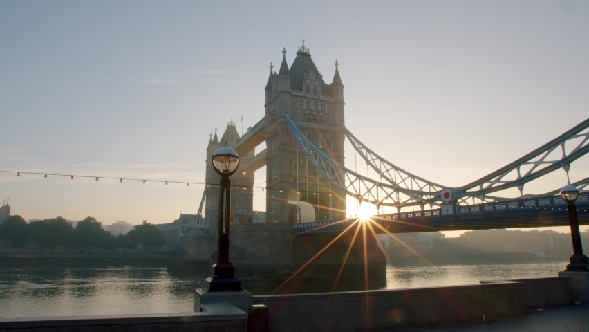 Lockdown in London, Tower Bridge at golden hour with completely empty streets and roads during the COVID-19 pandemic 2020. | Shutterstock HD Video #1061297269