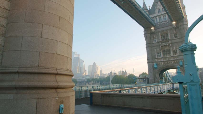 Lockdown in London, lone cyclist riding across Tower Bridge during the COVID-19 pandemic 2020, with The Scalpel, Gherkin and Walkie Talkie in the background. Royalty-Free Stock Footage #1061297545
