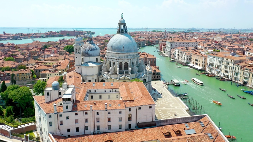 Aerial view of Venice, Italy. Basilica di Santa Maria della Salute, Grand Canal and lagoon. Venice skyline. Panorama of Venice from above in summer.