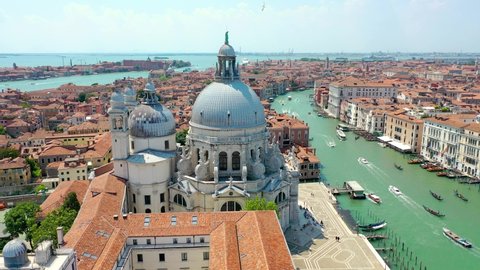Aerial view of Venice, Italy. Basilica di Santa Maria della Salute, Grand Canal and lagoon. Venice skyline. Panorama of Venice from above in summer.